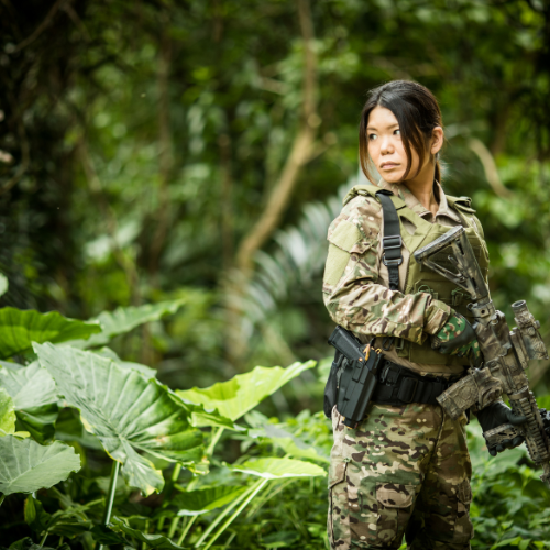 Asian woman in military camo clothes
